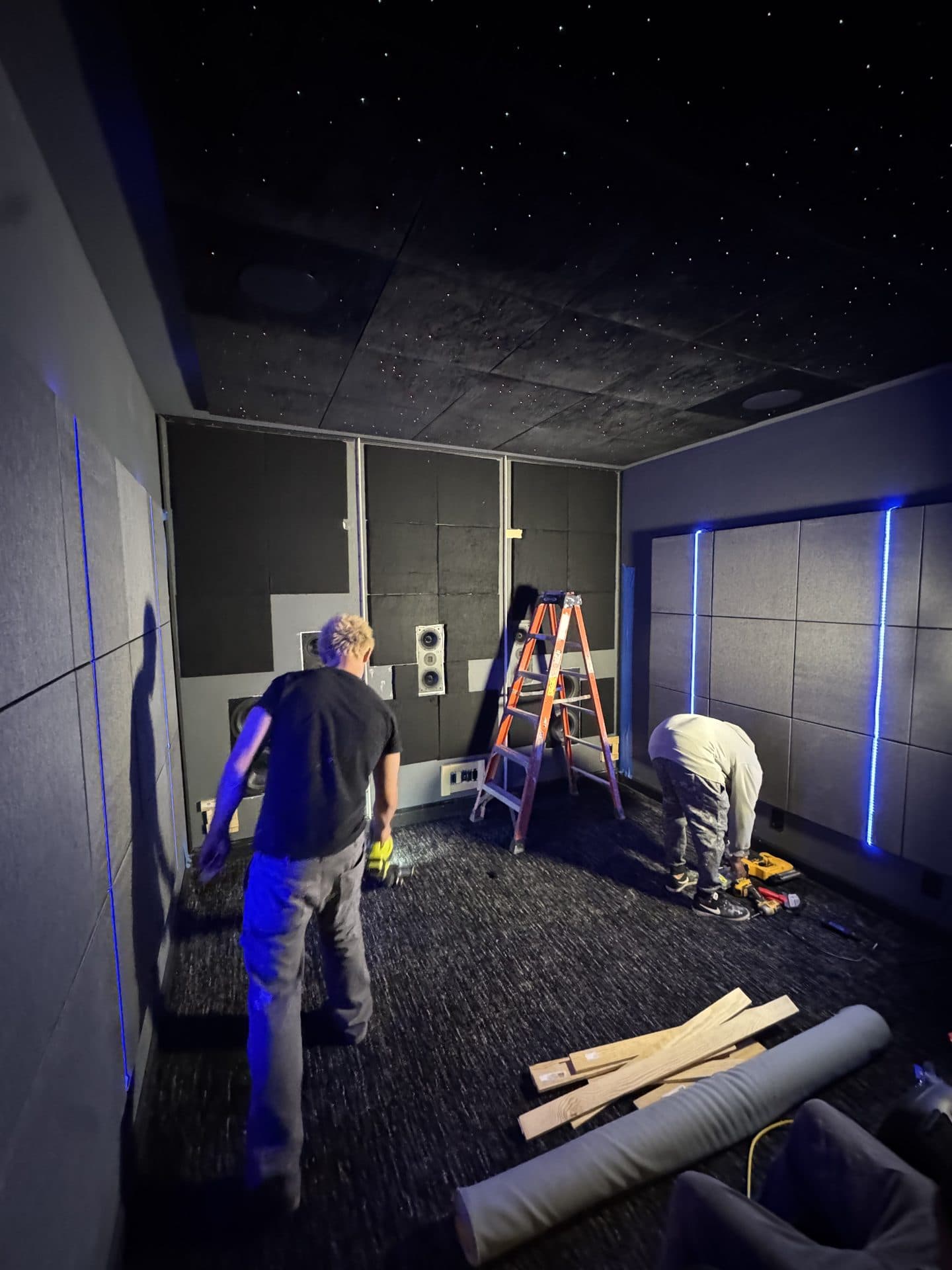 CineLuxe panel installation — frames being mounted by installers