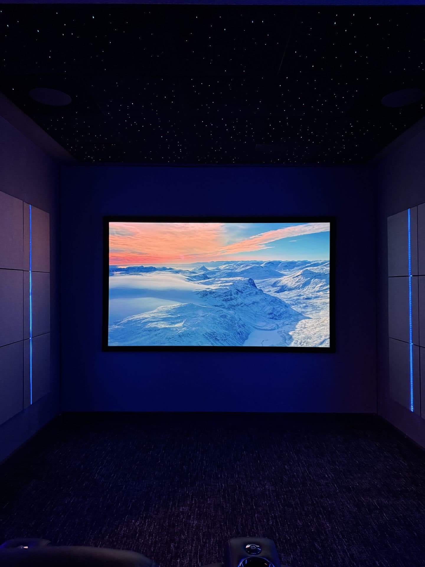 CineLuxe finished private cinema room — star ceiling, LED lighting, acoustic panels